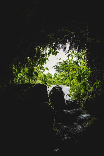 people looking out of a lava tube