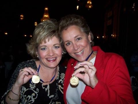 Two women with gold medals