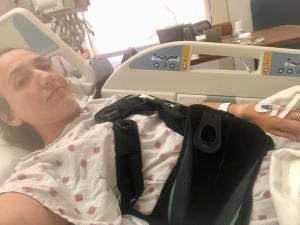 Roxanne Carlile laying in hospital bed after she broke her back