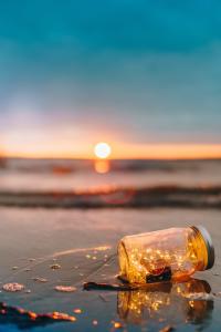 lights in a bottle on the beach