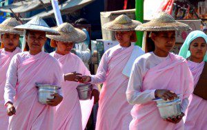 Burmese nuns on alms rounds, Burma 2011