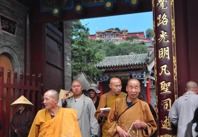 monks leaving a ceremony at wutai shan