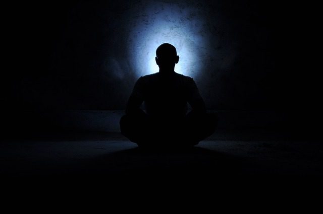 monk in darkness