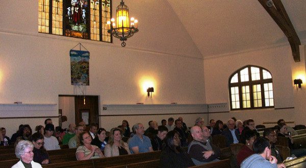 Crowd Gathers in House of Worship. photo by by AFL-CIO. (cc) 2004.