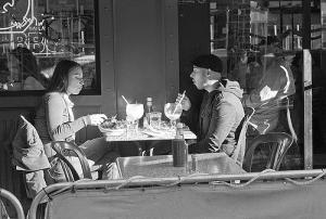cafe couple with big drinks, photo by Susan Sermonetta (cc) 2007.