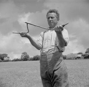 George Casely uses a hazel twig to find water 