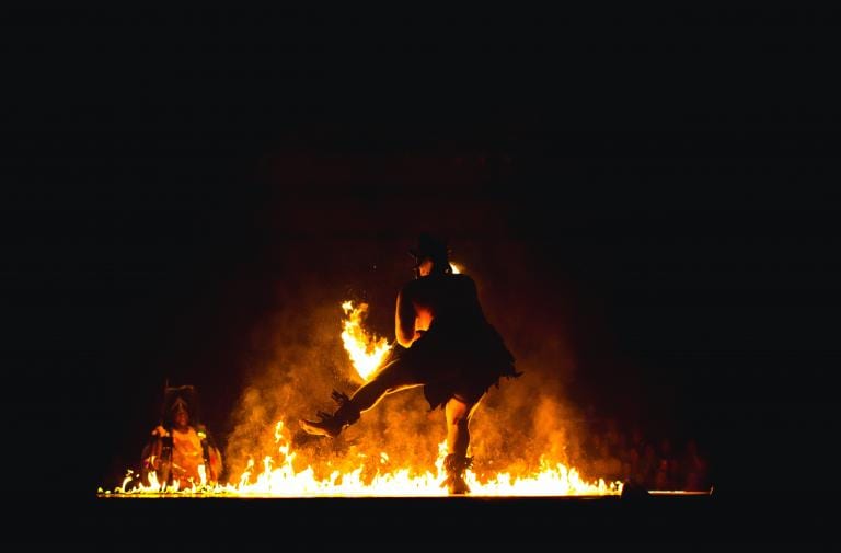 dancing figure before fire