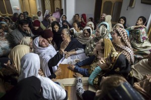 Women mourn the death of 15-year-old Mohammed Ali Khan, one of the over 160 killed during a brutal attack on a school in Peshawar, Pakistan. Image by Zohra Bensemra/Reuters
