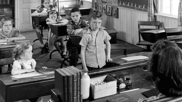 OVER TEACHERS SHOULDER TO CHILDREN