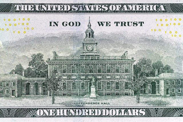 god trust money political