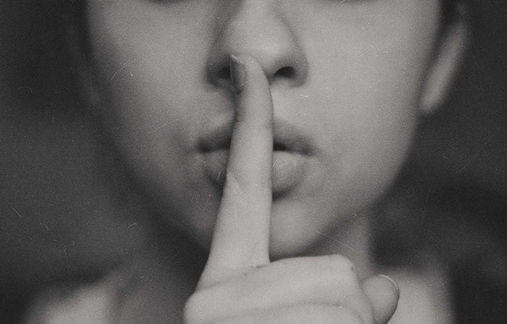 finger to lips (CC0 Kristina Flour on Unsplash)