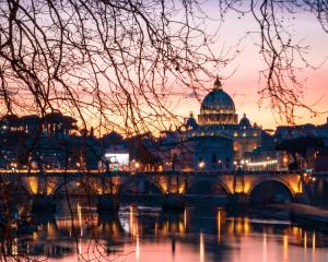 St Peter's from across the River at sunset(CC0 John Rodenn Castillo on Unsplash)