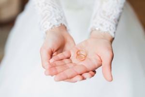 wedding rings in hand (CC0 Petr Ovralov on Unsplash)