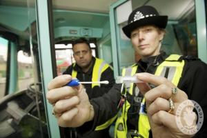 Police with DNA swab exhibit