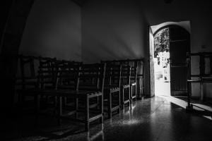 Church door open with light streaming in