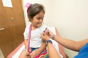 Girl happy after getting vaccinated