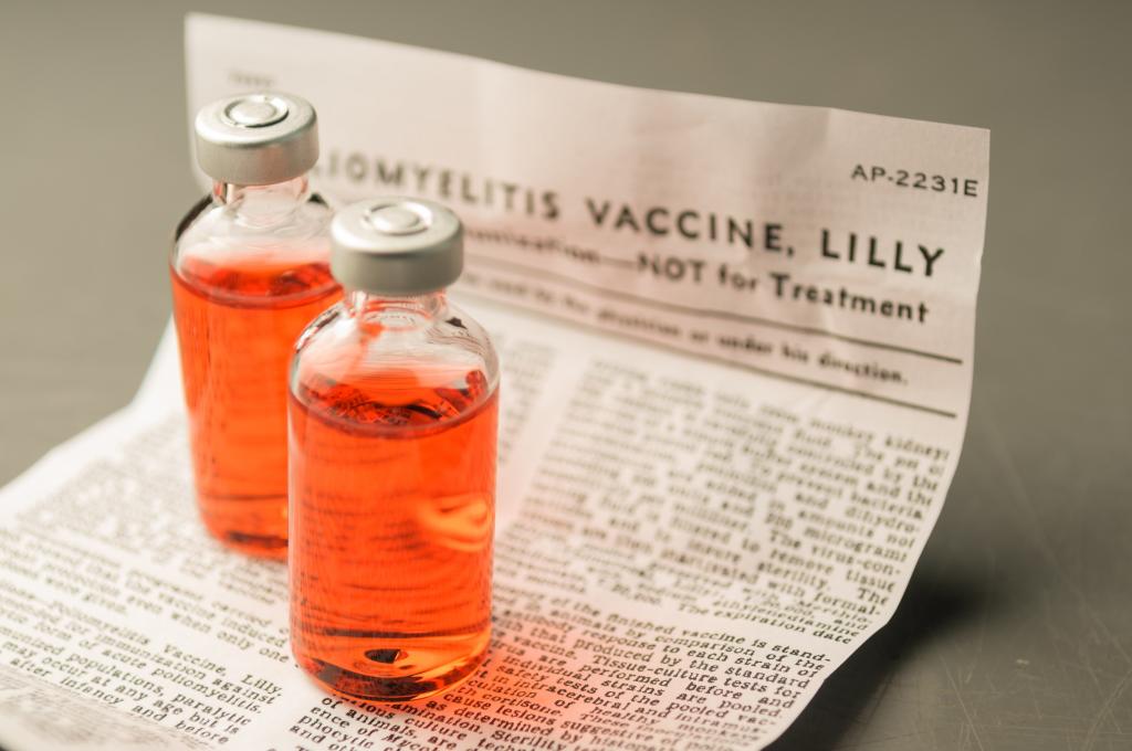 two vaccine vials on a document
