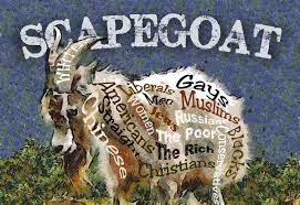 A goat labeled with the names of despised groups.