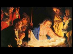 Jesus in the manger surrounded by Mary, Joseph, and shepherds.