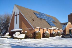 A church with solar panels on the roof.