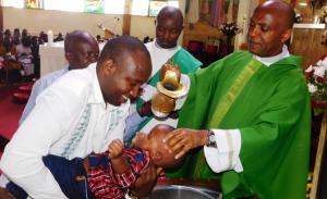 A child is baptized.