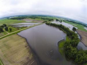 Far from negotiators at COP25, flooded farm fields in Minnesota are some of the effects of global warming.