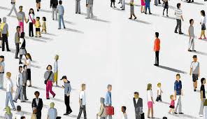 One apparently lonely person stands out from a crowd of people, each engaged with something or someone else.