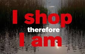 Against a background of a nature scene, the legend: "I shop therefore I am."