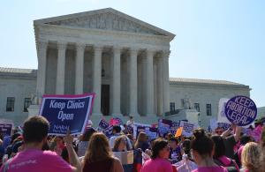 Demonstrators protest in favor of Roe v Wade in front of the Supreme Court building. Signs include, "Keep abortion legal."
