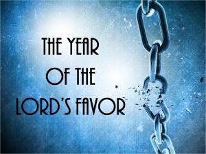 Chain with link broken and the text: The Year of the Lord's Favor"