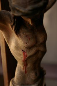 Jesus' head hangs down over his pierced chest in a depiction of the crucifixion.