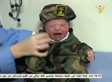 Proud Muslim Parents, Just After Giving Birth, Dress Baby in Battle Fatigues, Promise He’ll Be a Martyr For Islam