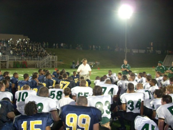 FCA’s caption: "William Fleming and Northside football teams meeting in the middle of the field to hear about Jesus and pray" (Image via Facebook)