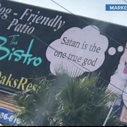 Hacked Florida Billboard Features Cute Dog Saying, “Satan is the One True God”