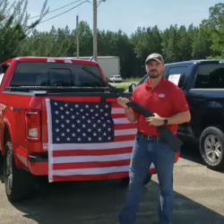 Buy a Truck from This Dealer and He’ll Toss in a Flag. And a Bible. And a Gun.