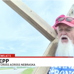 Retired Preacher Drags Wooden Cross (With a Little Wheel) All Across America